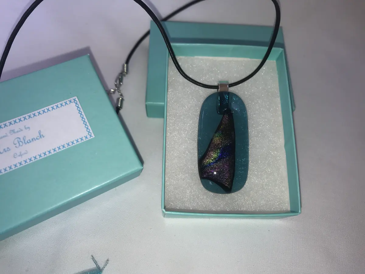Sea green transparent pendant with multicoloured dichroic triangular decoration P012 SOLD