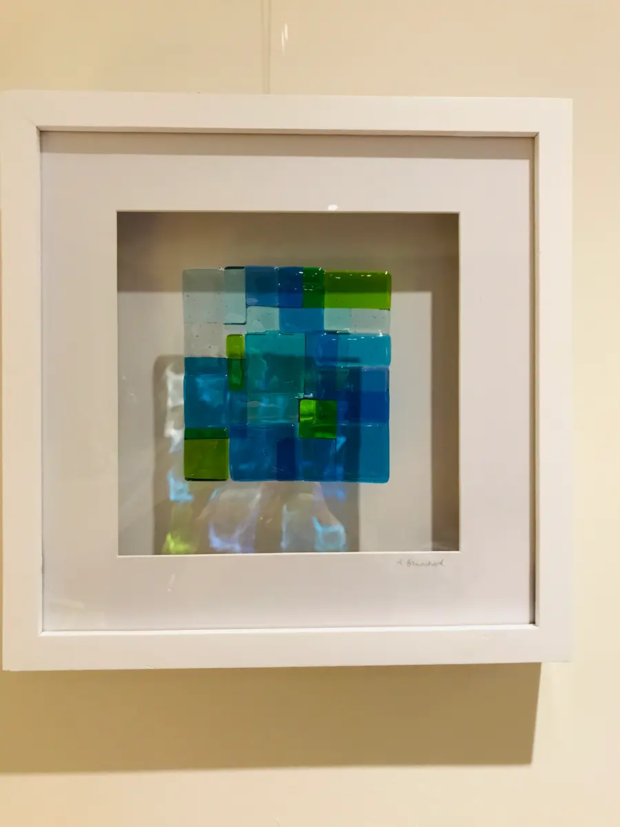 Blue/green glass picture. Glass approx 13cm x 12cm. Frame approx 35cm square. £50.00
