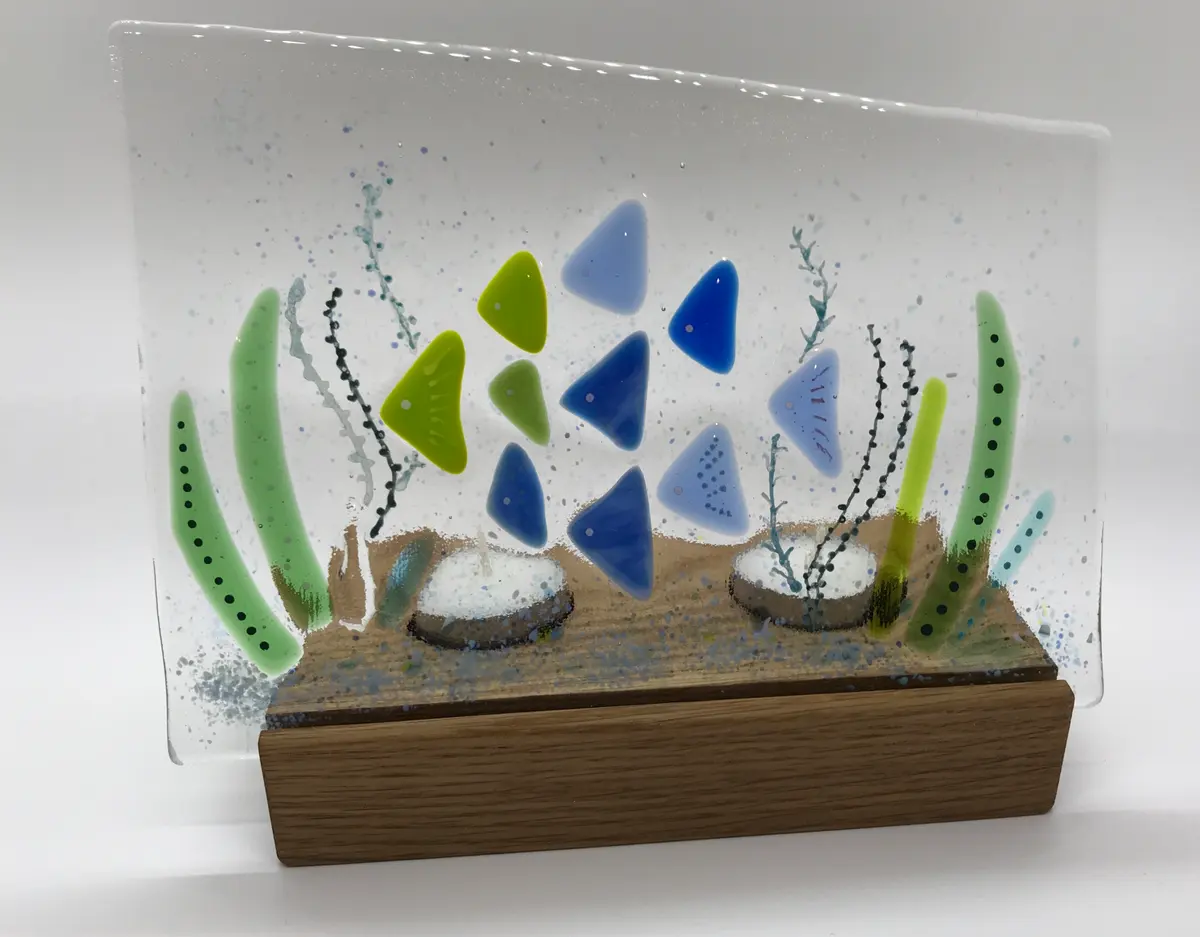 Fused and painted double tea light panel on oak stand. Base approx 17cm x 8.5cm £25.00.