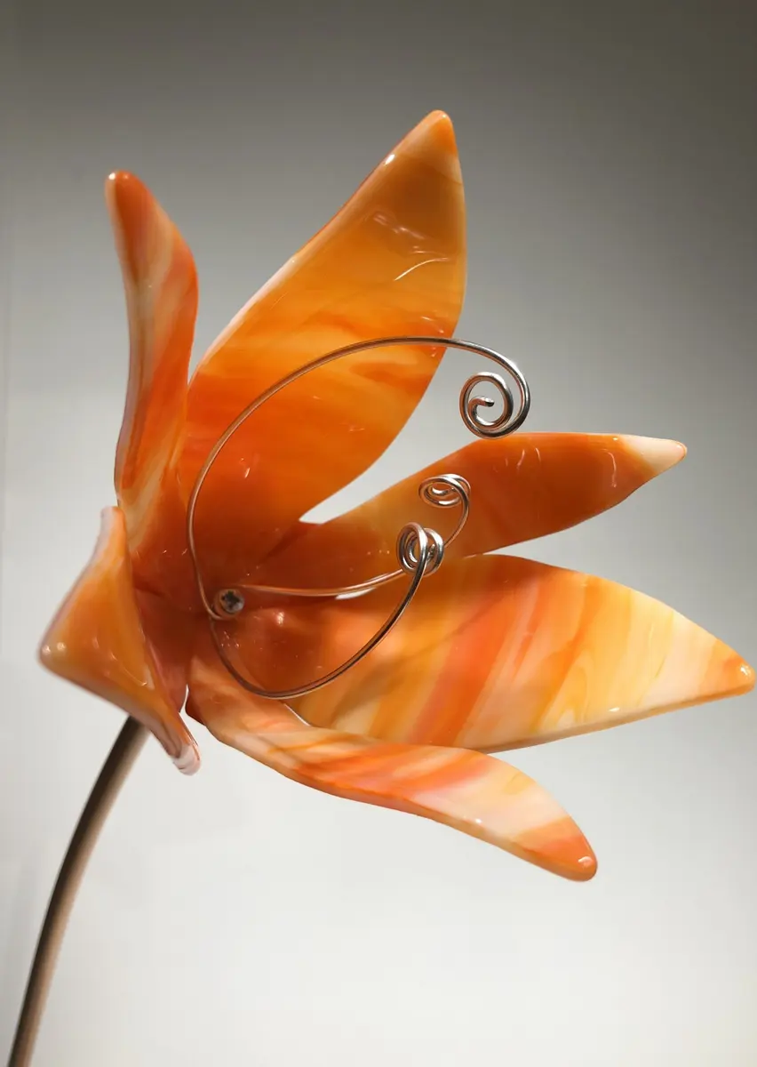 Orange streaky flower. Garden art. Flower approx 13cm x 12cm on a copper stem 60cm £50.00.