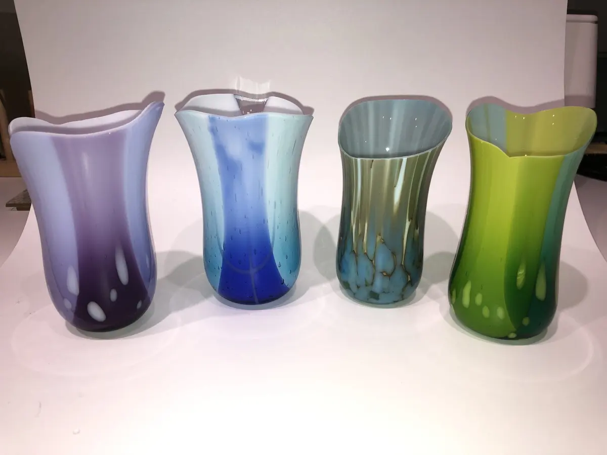 Various glass vases approx 10cm tall £50.00 each.