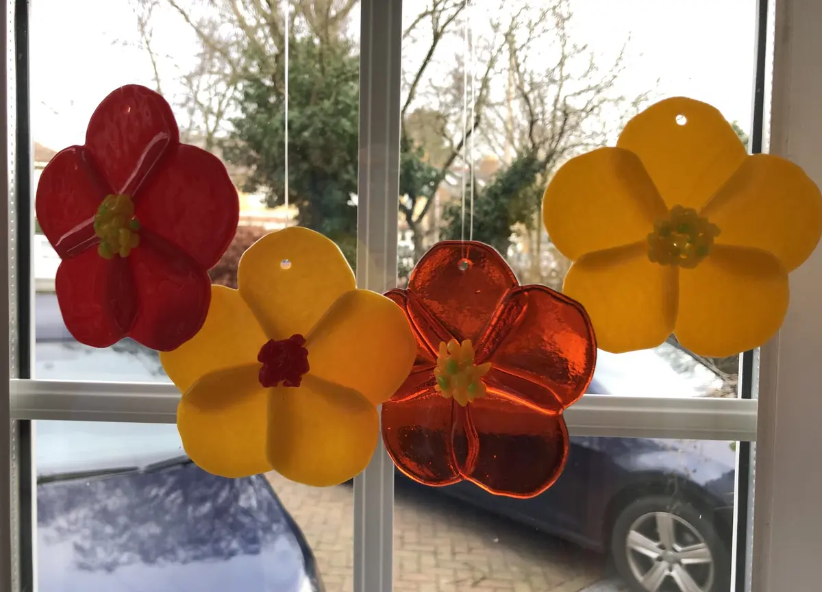 Individual hanging flower decorations in a variety of colours and sizes. Large ones £15 each small ones £10 each.