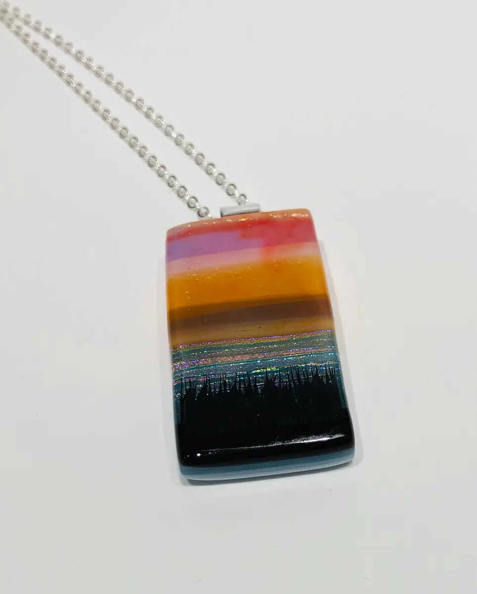 Sunset Pendant approx 2.5cm x 5cm. Supplied with a chain and come boxed. £45.00.