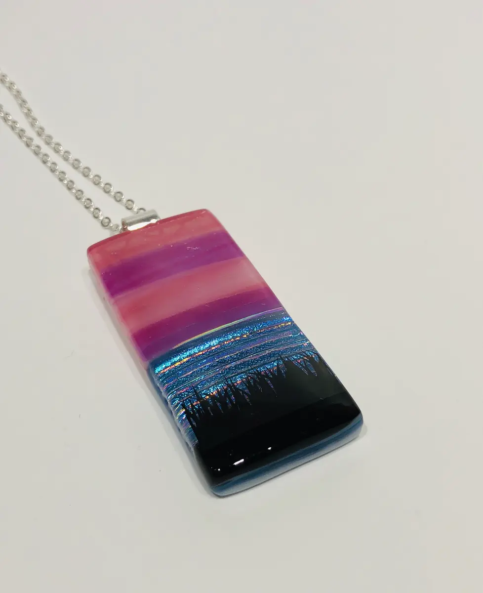 Sunset Pendant approx 2.5cm x 5cm. Supplied with a chain and come boxed. £45.00.